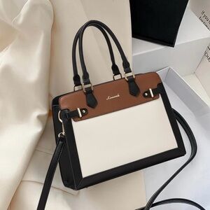 Black, white and brown hand bag. New with tags!